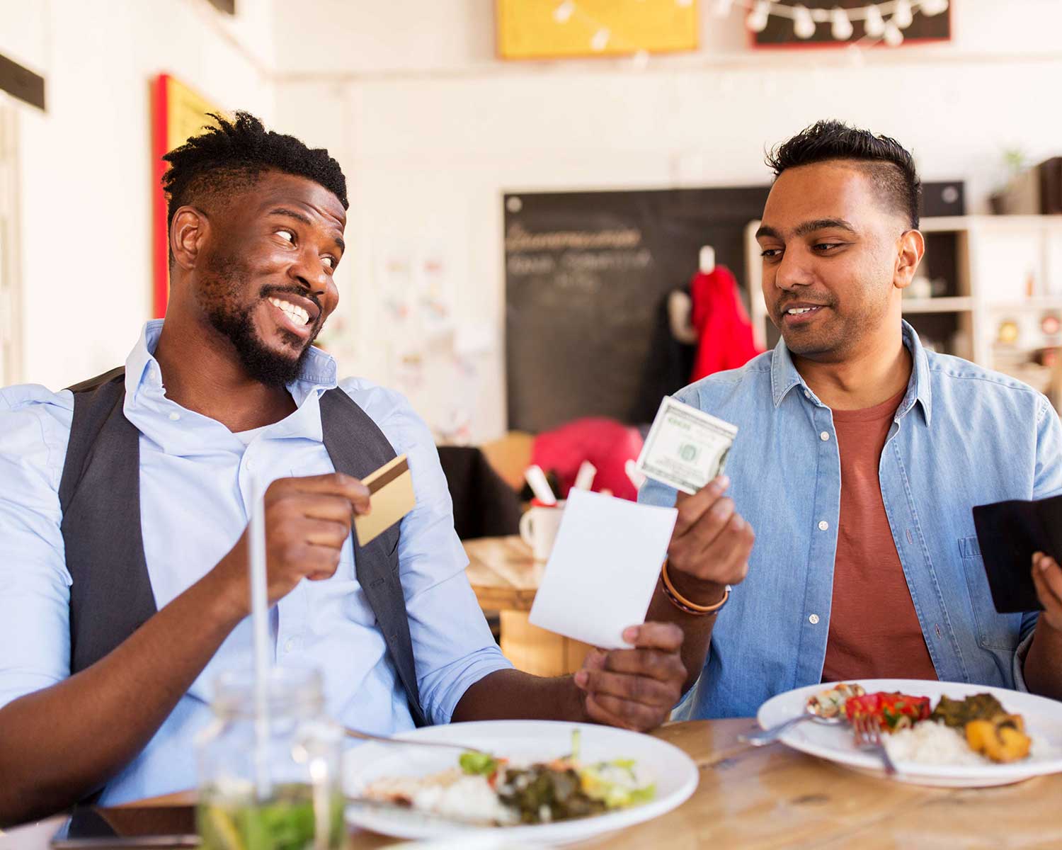 two men pay with either card or cash