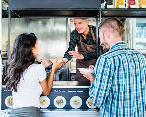 couple served food at a foodtruck | food truck pos