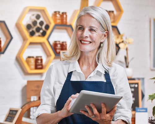 woman looking at ipad in store | payment solutions