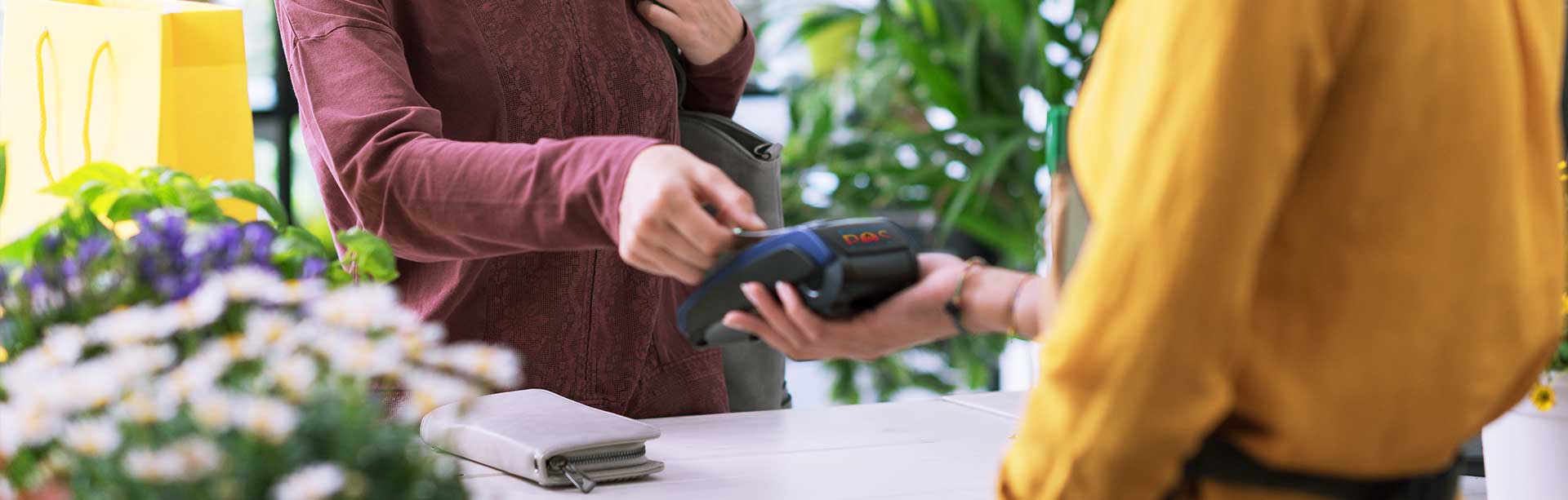 man paying for meal with phone | contactless pos