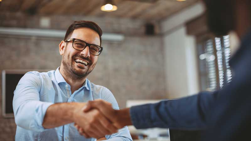 two men shaking hands | pay at the table pos 