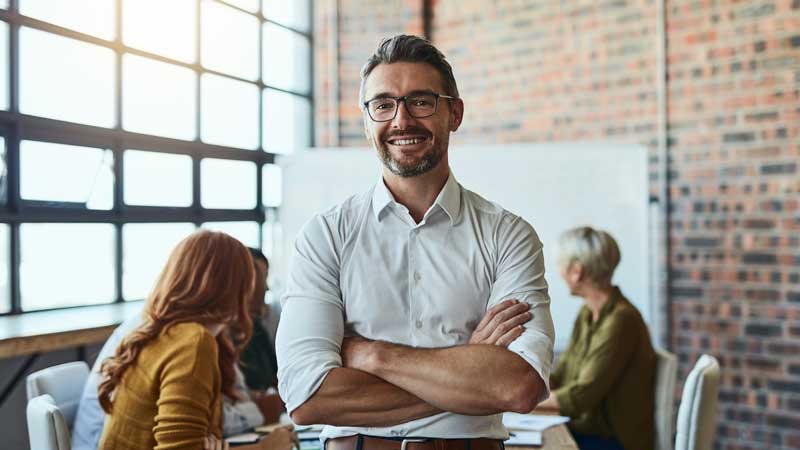 smiling woman working inside a liquor storeman in a meeting