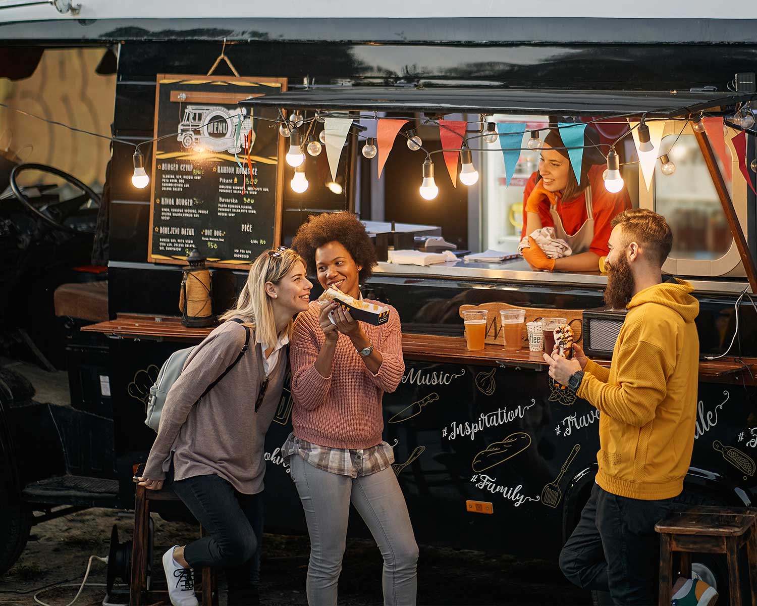 friends gaving fun in front of a food truck | food truck POS